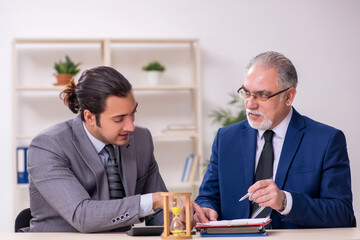 Two businessmen in time management concept