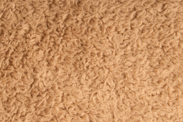 Brown shaggy blanket texture as background top view
