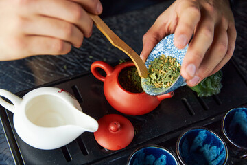a person makes tea, tea ceremony, tea set