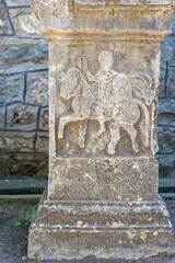 Sculpture of the knight on the horse on a roman stone 