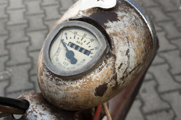 old rusty tachometer of a historical moped