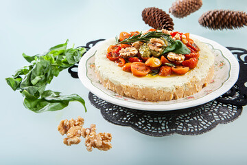 pesto cheesecake ready to eat and presented in the center of the table