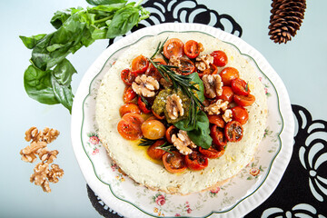 close-up of pesto cheesecake prepared to eat and presented in the center of the table. Top view