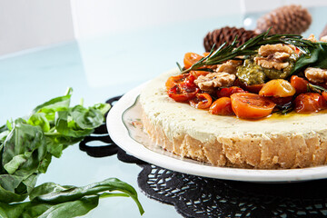 pesto cheesecake ready to eat and presented in the center of the table