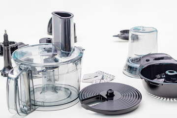 Natural light. black food processor. Near the nozzle for use. In the background is a kitchen for cooking.