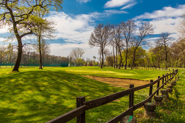 Fototapeta na wymiar Landscape with fence and sky. Golf course