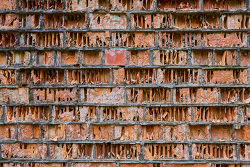 old red brick wall collapses under the influence of weathering, erosion eolation