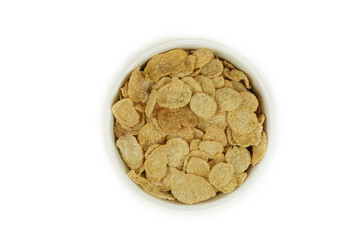 A bowl of cornflakes, top view. Isolated