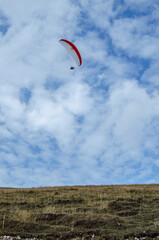 Fototapeta na wymiar Flying on a paraglider. View of the Monte Baldo mountain, Italy, from a height.