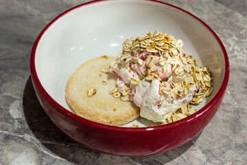 Cream dessert in a bowl with shortbread 