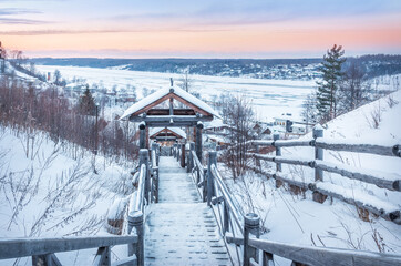 Wooden stairs from Mount Levitan and a view of the frozen Volga River in Plyos