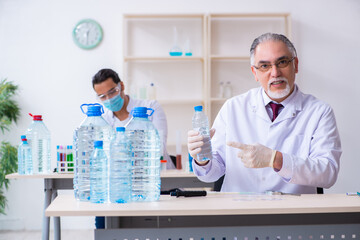 Two chemists working in the lab