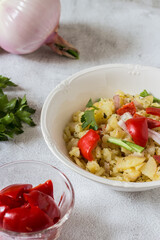 Boiled potato salad with sweet and sour peppers, celery and onion. Typical vegan dish of the peasant tradition.