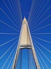 Low Angle View Of Suspension Bridge Against Blue Sky