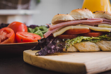 Gourmet Vegetable and Meat Sandwich with Orange Juice