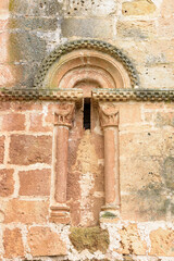 Fototapeta na wymiar Detail of the church of San Clemente, Huidobro. Romanesque temple of the XII century. Burgos, Castilla y Leon, Spain
