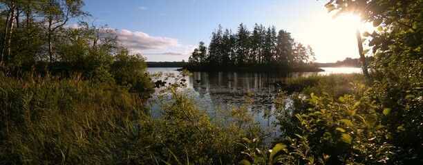 Idyllic lake scene with sunrays