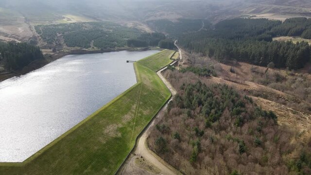 Aerial Drone View Stunning Reservoir of Water In Peak District West Yorkshire Holmfirth Yateholme With Forest Hike Walking trail