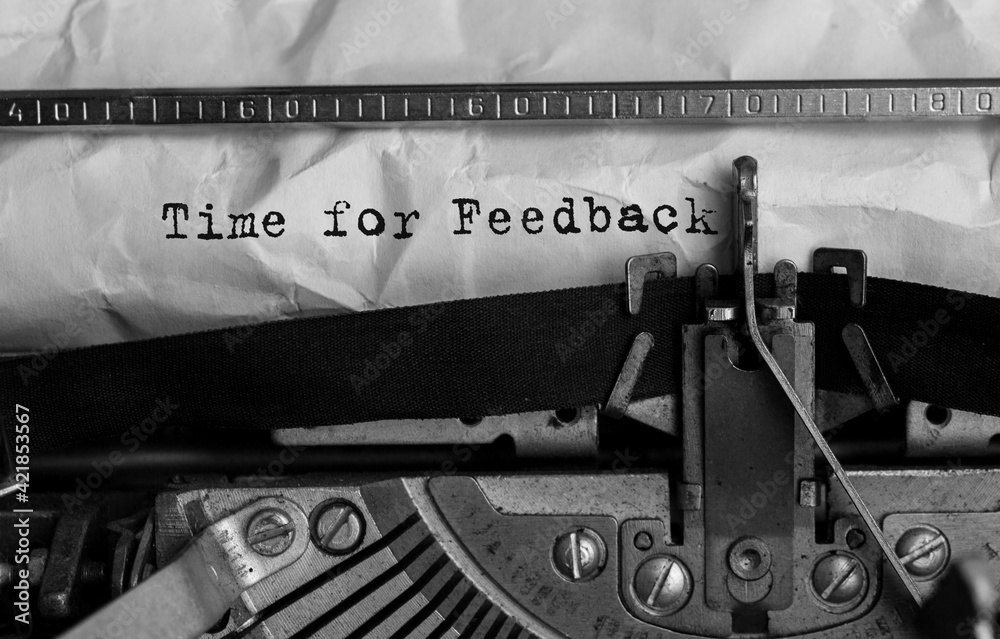 Fototapete text time for feedback typed on retro typewriter