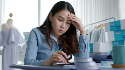 Young attractive asia female business owner thoughtful serious doubtful feel stress worry with...