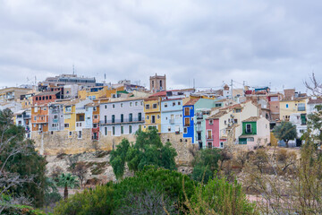 Fototapeta na wymiar View of the colorful houses of the town of Villajoyosa in a cloudy day.
