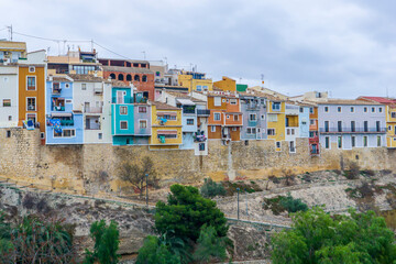 Fototapeta na wymiar View of the colorful houses of the town of Villajoyosa in a cloudy day.