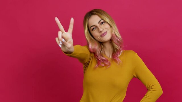 Young blonde woman happy and counting with fingers over isolated background