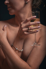 Young sexy girl with a glass of champagne
