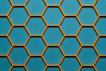 Yellow hexagonal cells grid on a blue background. Abstract geometric texture. Honeycomb concept