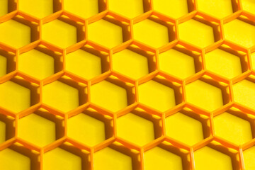 Hexagonal cells grid on a yellow background. Abstract geometric texture. Honeycomb concept