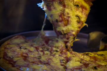 Obraz na płótnie Canvas pizza with ham and chees