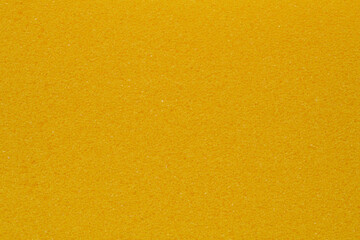 Yellow porous sponge texture background
