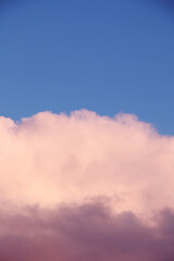 blue sunset sky with heavy fluffy cumulus clouds