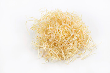 Light wood shavings on a white background for bedding in cages for pets, and for packing of the goods which are easily broken