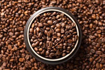 Coffee beans. Coffee beans are spread out on the surface.