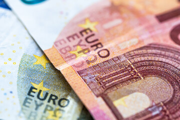 Fototapeta premium Euro money cash, 10 and 5 euro banknotes as a backdrop for topics such as economics, finance, savings and investment.