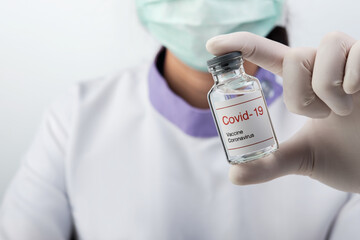 coronavirus vaccine COVID-19 .Coronavirus Vaccine concept in hand of doctor vaccine jar. Medical concept.