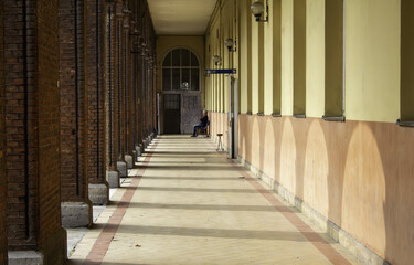 Fototapeta premium Man sitting in passage