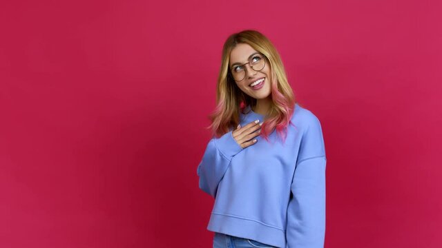 Young blonde woman with glasses and surprised over isolated background