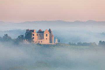 ruins of a monastery in the morning mist