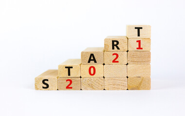 Business concept of 2021 new year start. Wooden blocks with words 'Start 2021'. Beautiful white...