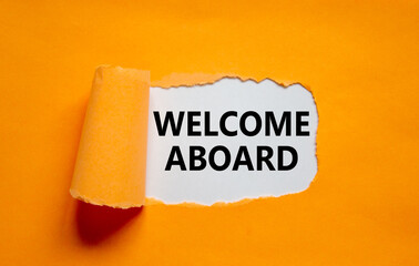Welcome aboard symbol. Words 'Welcome aboard' appearing behind torn orange paper. Beautiful orange background. Business, welcome aboard concept, copy space.