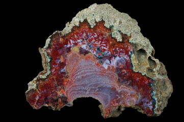 A cross-section of agate. Agate with many pseudomorphs.Multicolored silica bands colored with metal...
