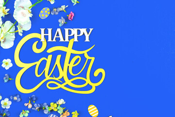 Happy Easter flat lay background with text message and congratulation with spring holiday