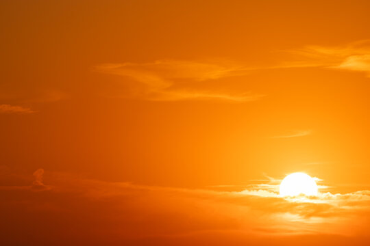Golden hour sunset. View of sun. Details of sunset with orange sky.