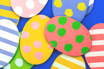 Flat lay easter background with painted colorful eggs