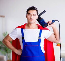 Superhero repairman with tools in repair concept