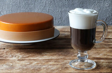 Mousse cake with a glass of Irish coffee on the table