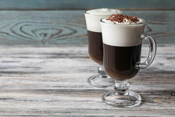 Two different Irish coffee glasses with copy space