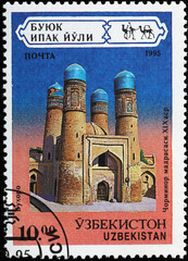 Splendid madrasa of Bukhara on stamp from Uzbekistan